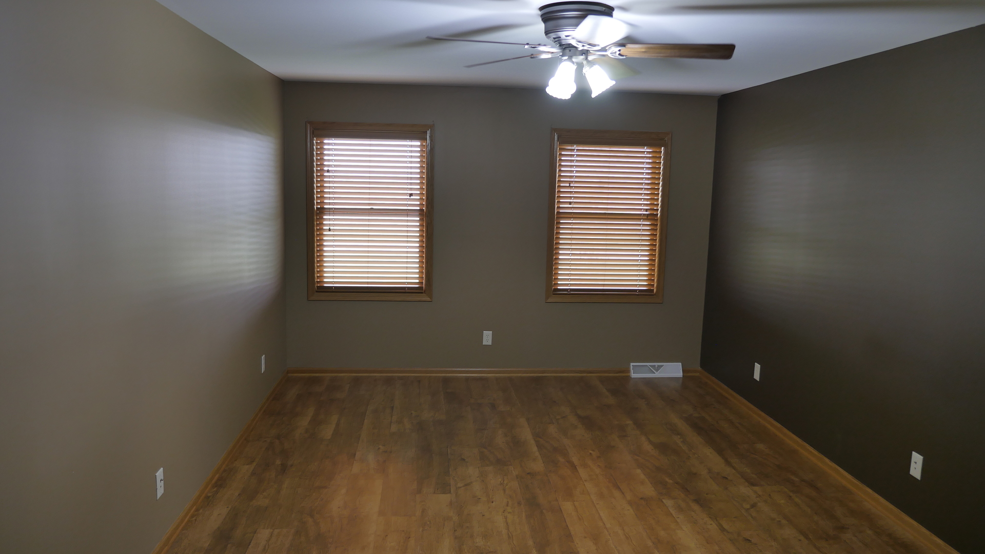 874 North 36th Road Utica, IL 61373 - Photo 6 of 14 a view of an empty room with wooden floor and a window