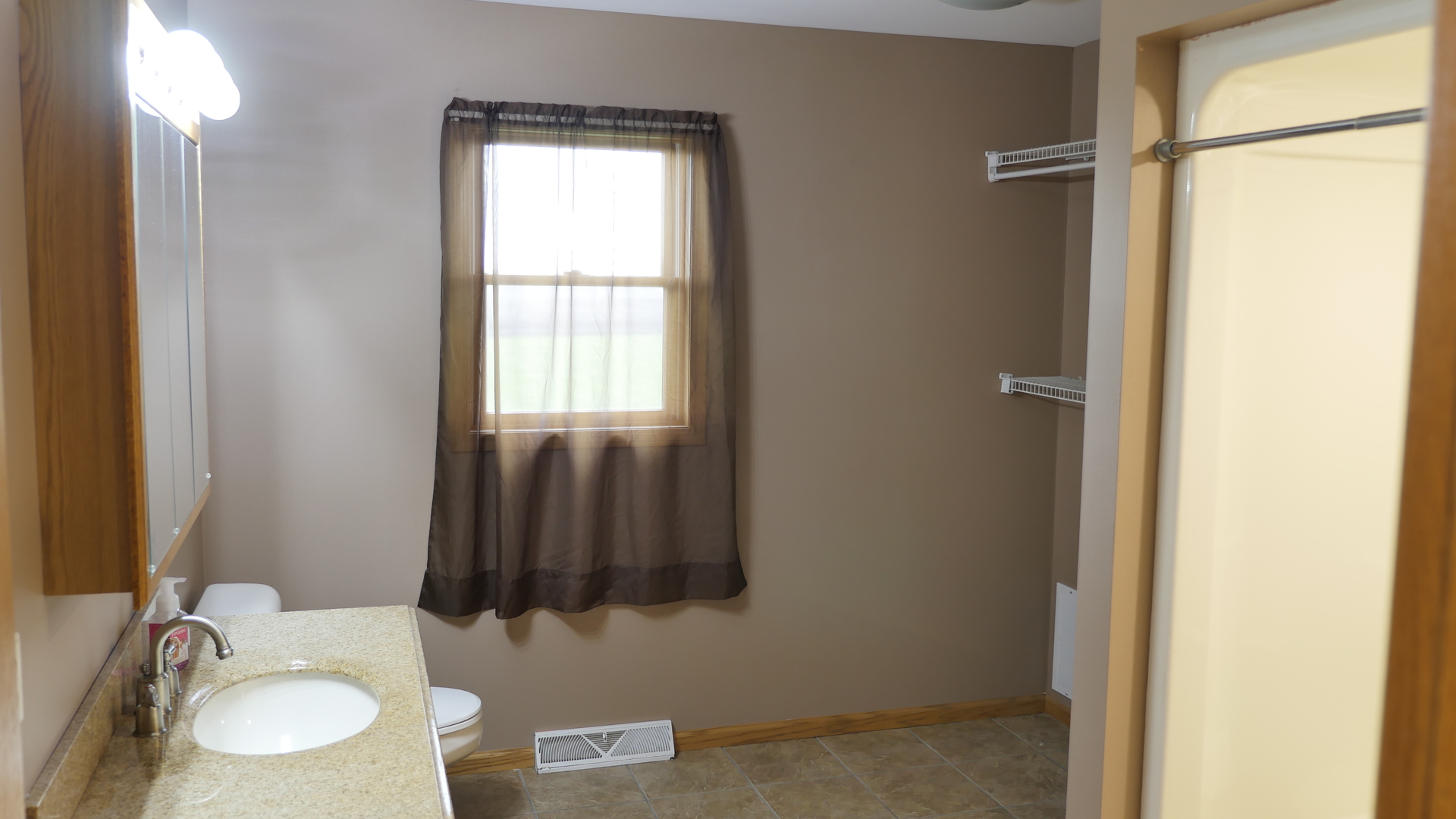 874 North 36th Road Utica, IL 61373 - Photo 9 of 14 a bathroom with a sink and a mirror