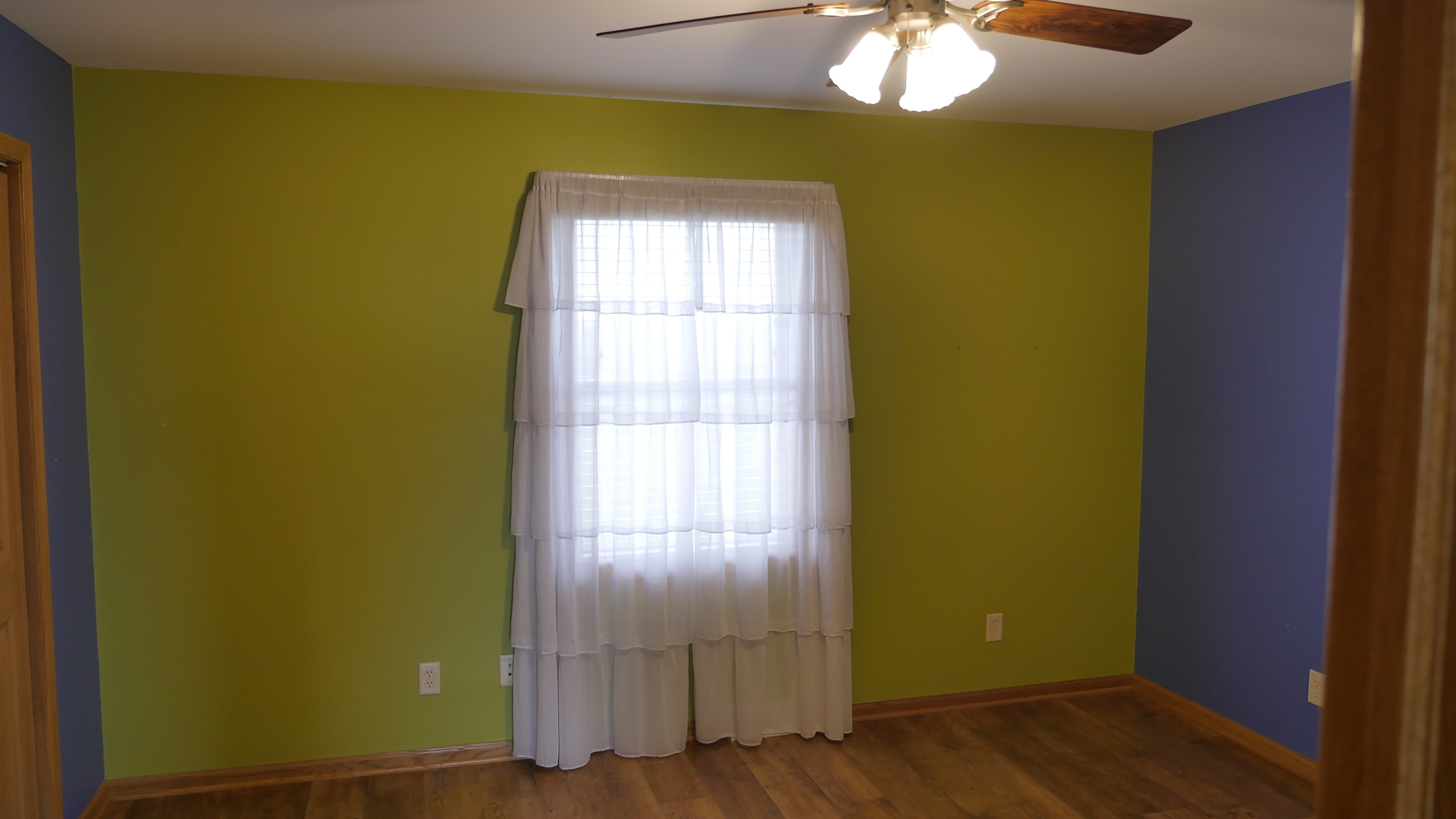 874 North 36th Road Utica, IL 61373 - Photo 10 of 14 a view of empty room with window and wooden floor
