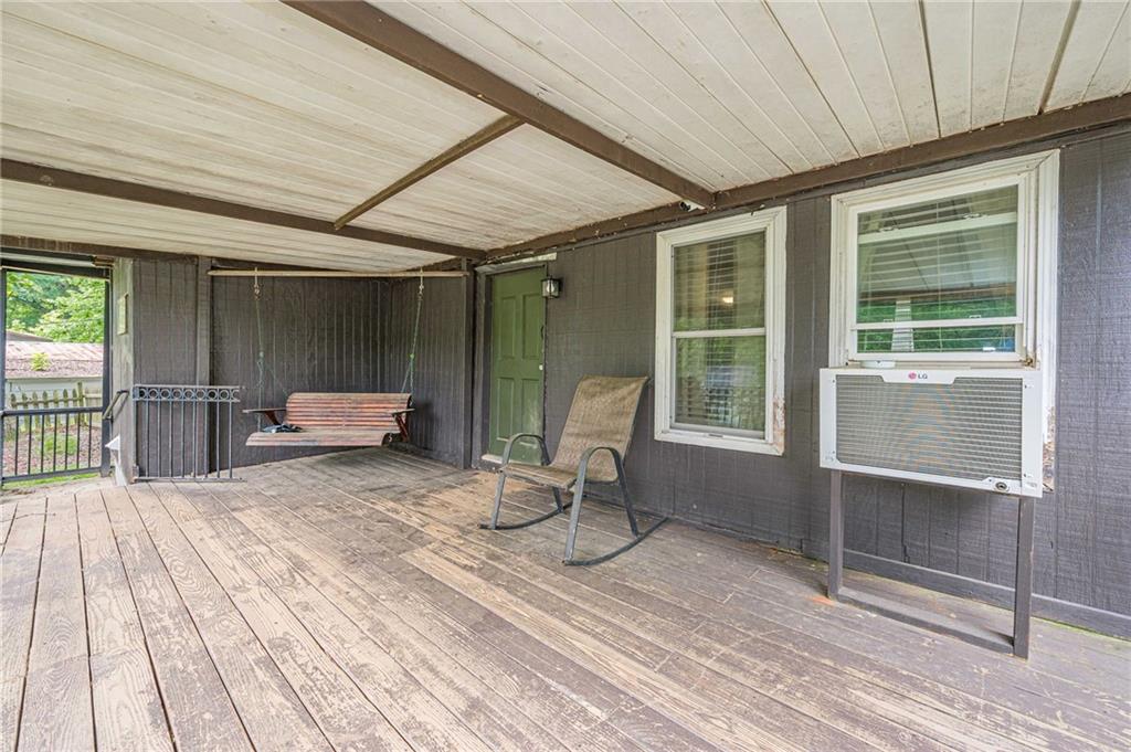 90 Valley Trail Southeast Acworth, GA 30101 - Photo 4 of 28 a view of a balcony with wooden floor and iron stairs