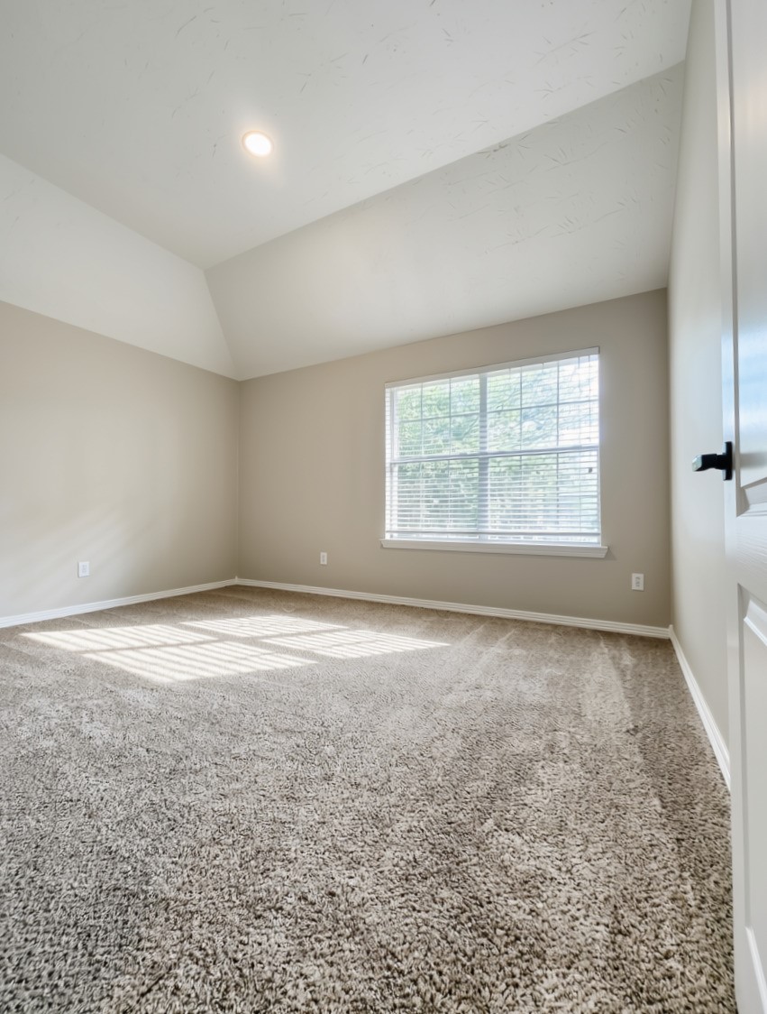 3002 Mayday Run Court Spring, TX 77373 - Photo 26 of 31 Fourth bedroom featuring a spacious layout with ample room for a bed, furnishings, and storage, offering a comfortable and functional private space.