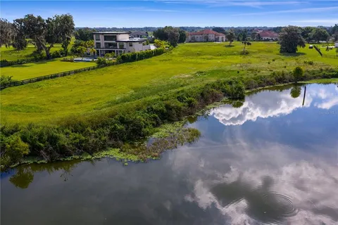 a view of a lake with houses in the background