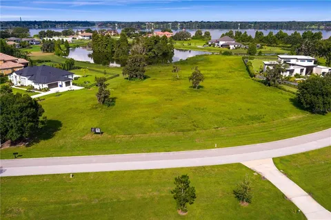 a view of a swimming pool and an outdoor seating