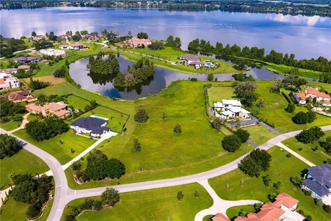 a view of a swimming pool with a yard