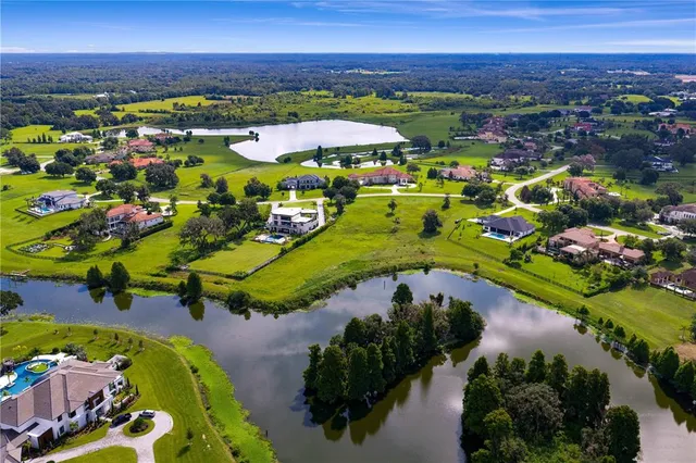 a view of a swimming pool with a table and chairs