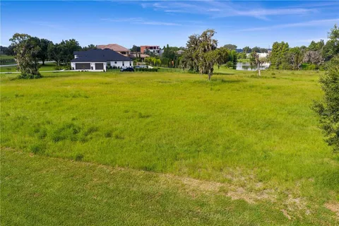 a view of an ocean with a building in the background