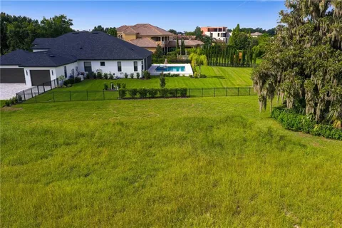 a view of a lake with houses in the back