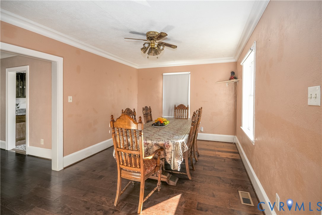 4903 Castlewood Road Richmond, VA 23234 - Photo 22 of 34 a view of a dining room with furniture and wooden floor
