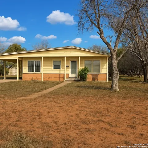 front view of a house with a yard