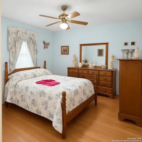 a bedroom with a bed and a dresser