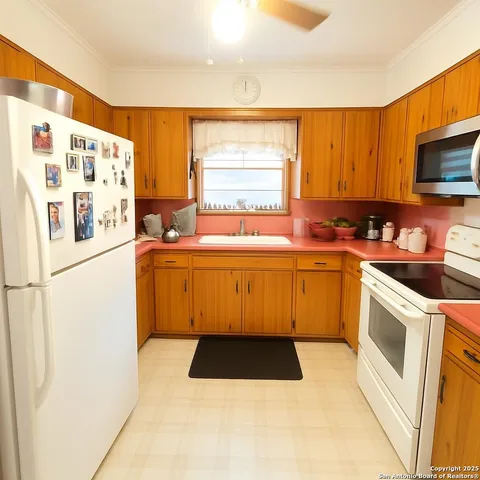 a utility room with sink dryer and washer