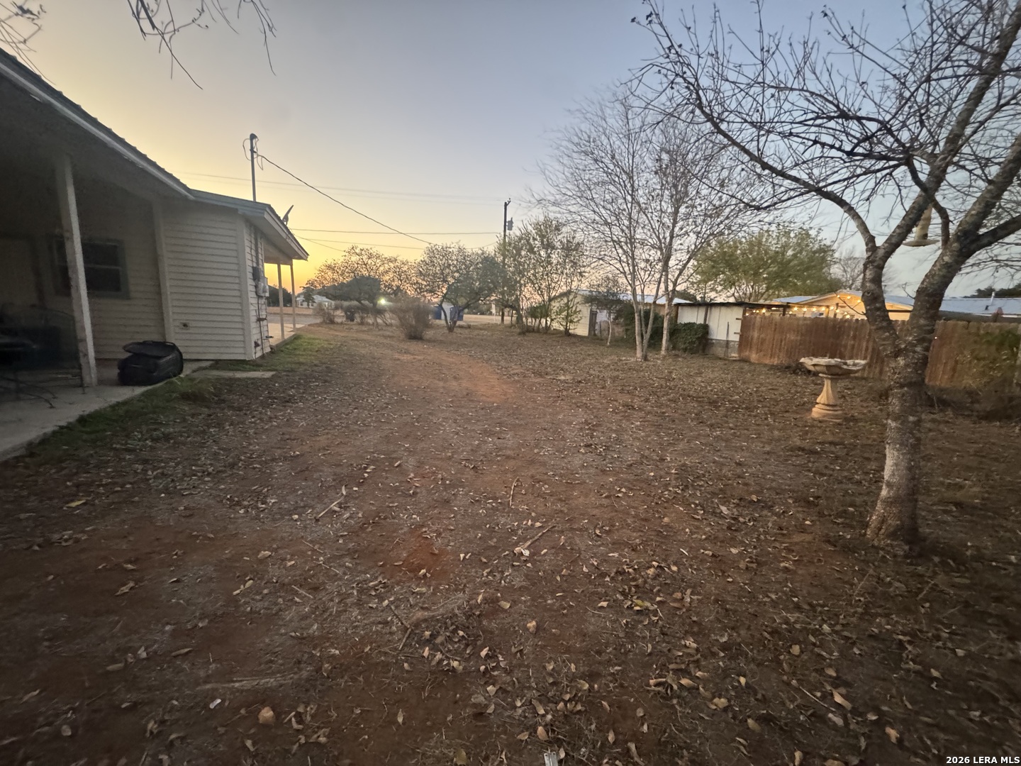 504 North Cedar Street Pearsall, TX 78061 - Photo 20 of 23 a view of a house with a yard
