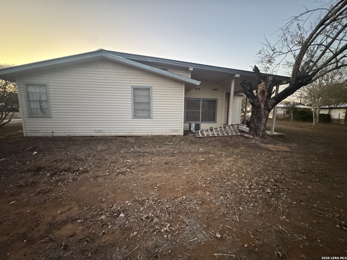 504 North Cedar Street Pearsall, TX 78061 - Photo 22 of 23 a house view with a backyard space