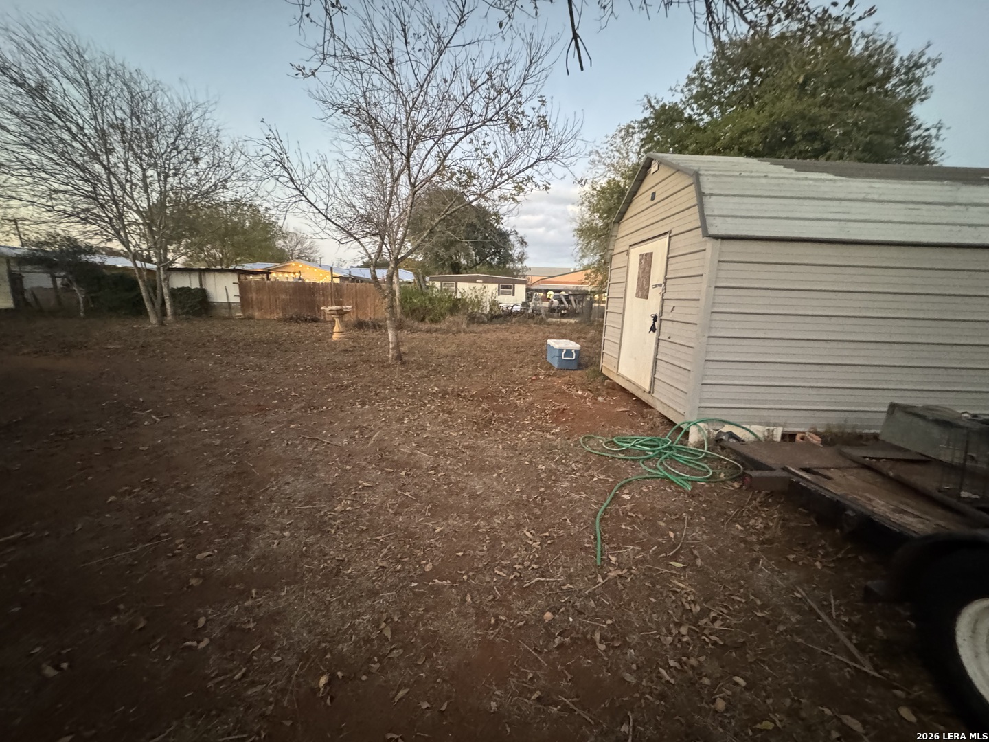 504 North Cedar Street Pearsall, TX 78061 - Photo 23 of 23 a view of a house with a yard