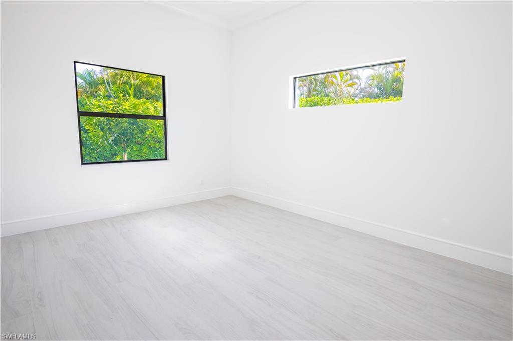 231 Legacy Court Naples, FL 34110 - Photo 22 of 35 an empty room with a window
