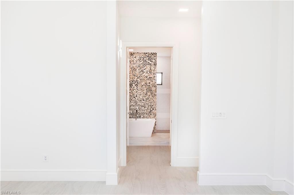 231 Legacy Court Naples, FL 34110 - Photo 24 of 35 a bathroom with a toilet