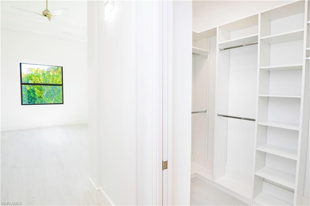 231 Legacy Court Naples, FL 34110 - Photo 26 of 35 a view of a small space with closet