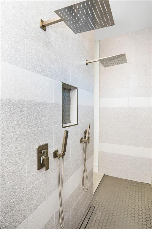 231 Legacy Court Naples, FL 34110 - Photo 29 of 35 a bathroom with a shower