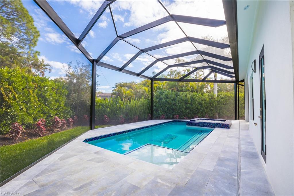 231 Legacy Court Naples, FL 34110 - Photo 3 of 35 a view of an indoor swimming pool