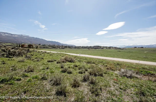 a view of a lake with mountains in the background