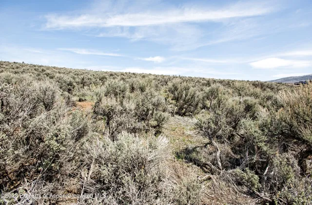 a view of an ocean and a mountain