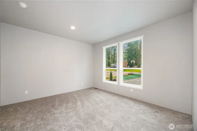 a view of a lake with a house in background