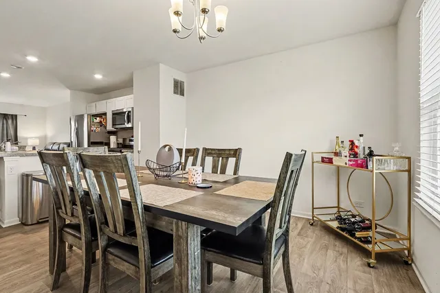 a dining room with furniture and window