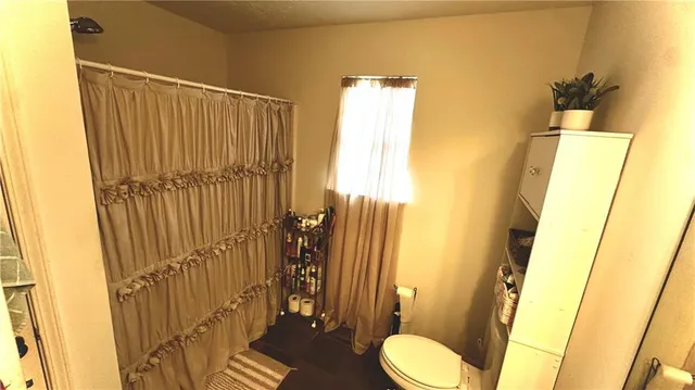 a bathroom with a sink and toilet