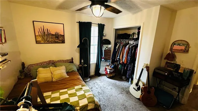 a bed room with a bed and a mirror