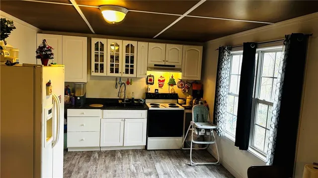 a kitchen with stainless steel appliances granite countertop a stove and a refrigerator
