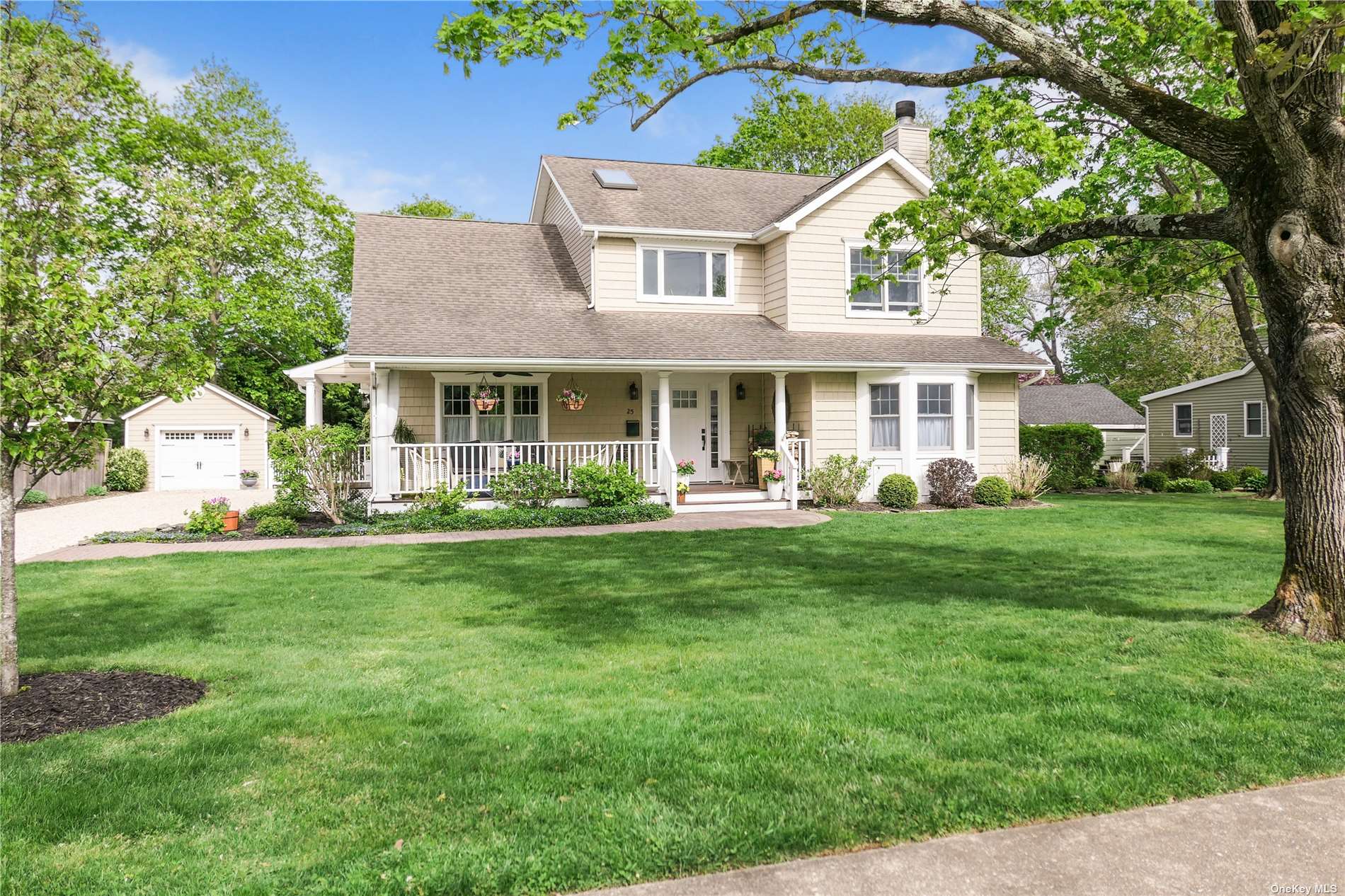 a front view of a house with a yard table and chairs