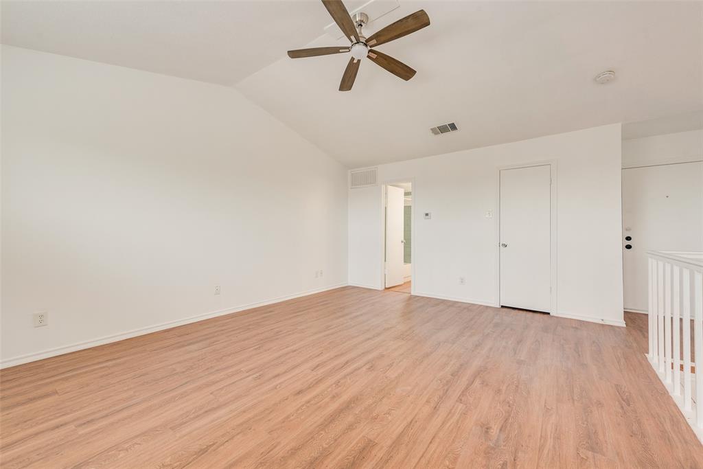 14277 Preston Road, Unit 823 Dallas, TX 75254 - Photo 11 of 25 a view of an empty room with wooden floor