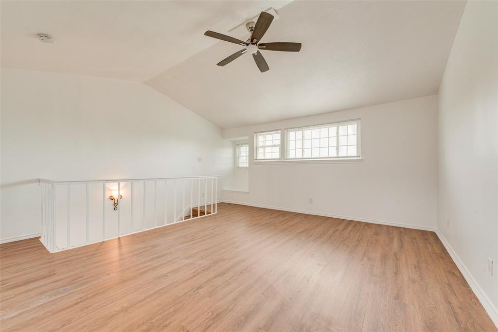 14277 Preston Road, Unit 823 Dallas, TX 75254 - Photo 12 of 25 wooden floor in an empty room with a window