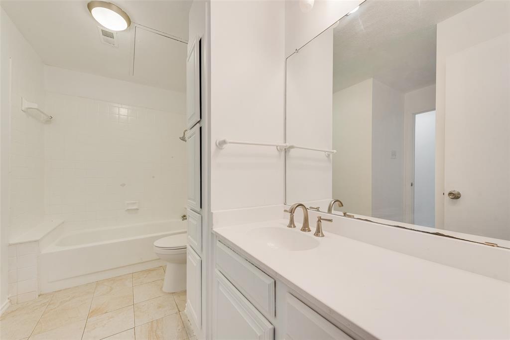 14277 Preston Road, Unit 823 Dallas, TX 75254 - Photo 15 of 25 a bathroom with a sink toilet and shower