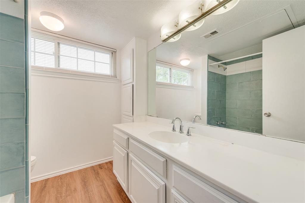 14277 Preston Road, Unit 823 Dallas, TX 75254 - Photo 18 of 25 a bathroom with a sink a vanity and a mirror