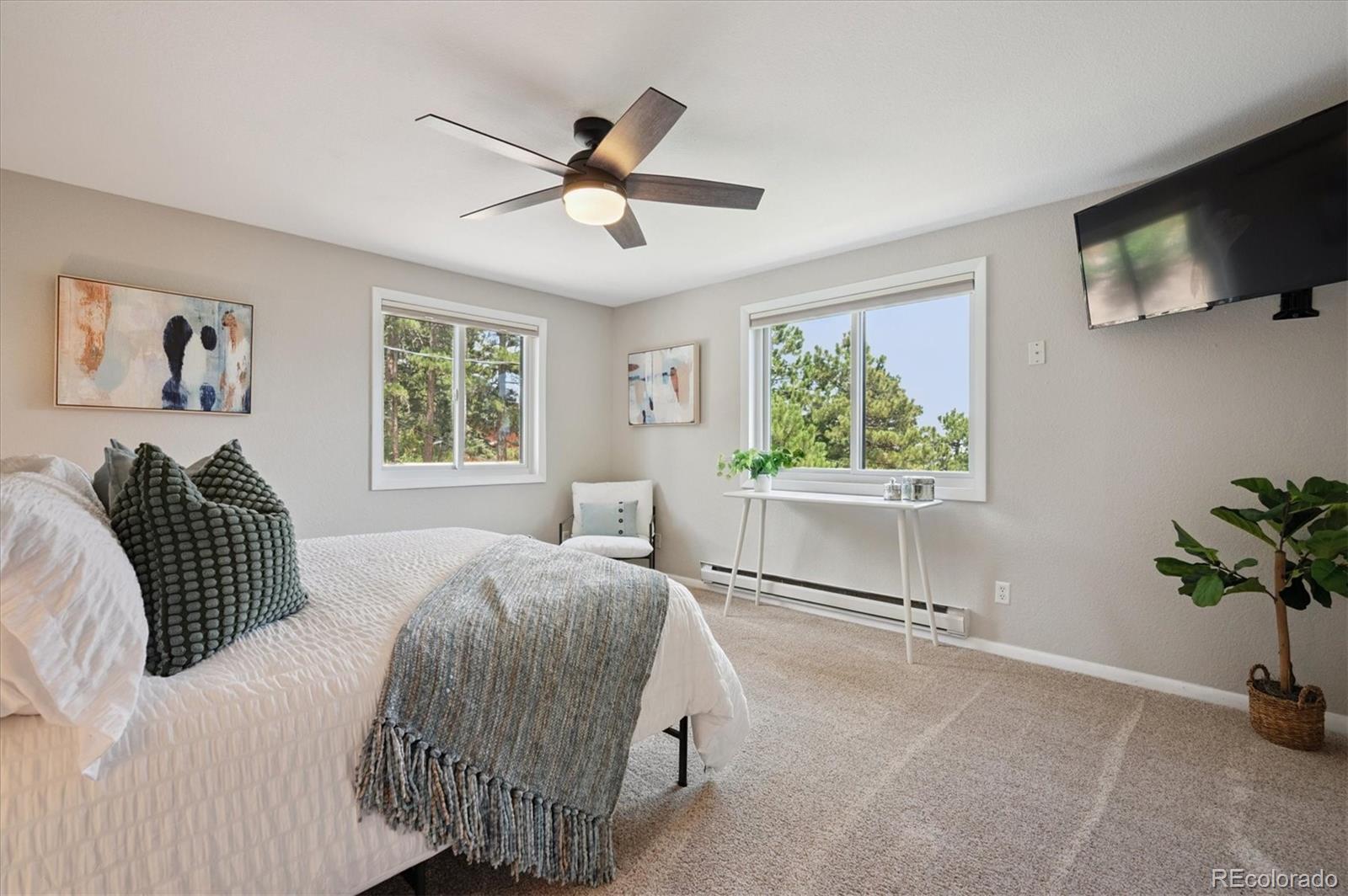 9189 Fallen Rock Road Conifer, CO 80433 - Photo 17 of 47 a living room with a bed furniture and a window