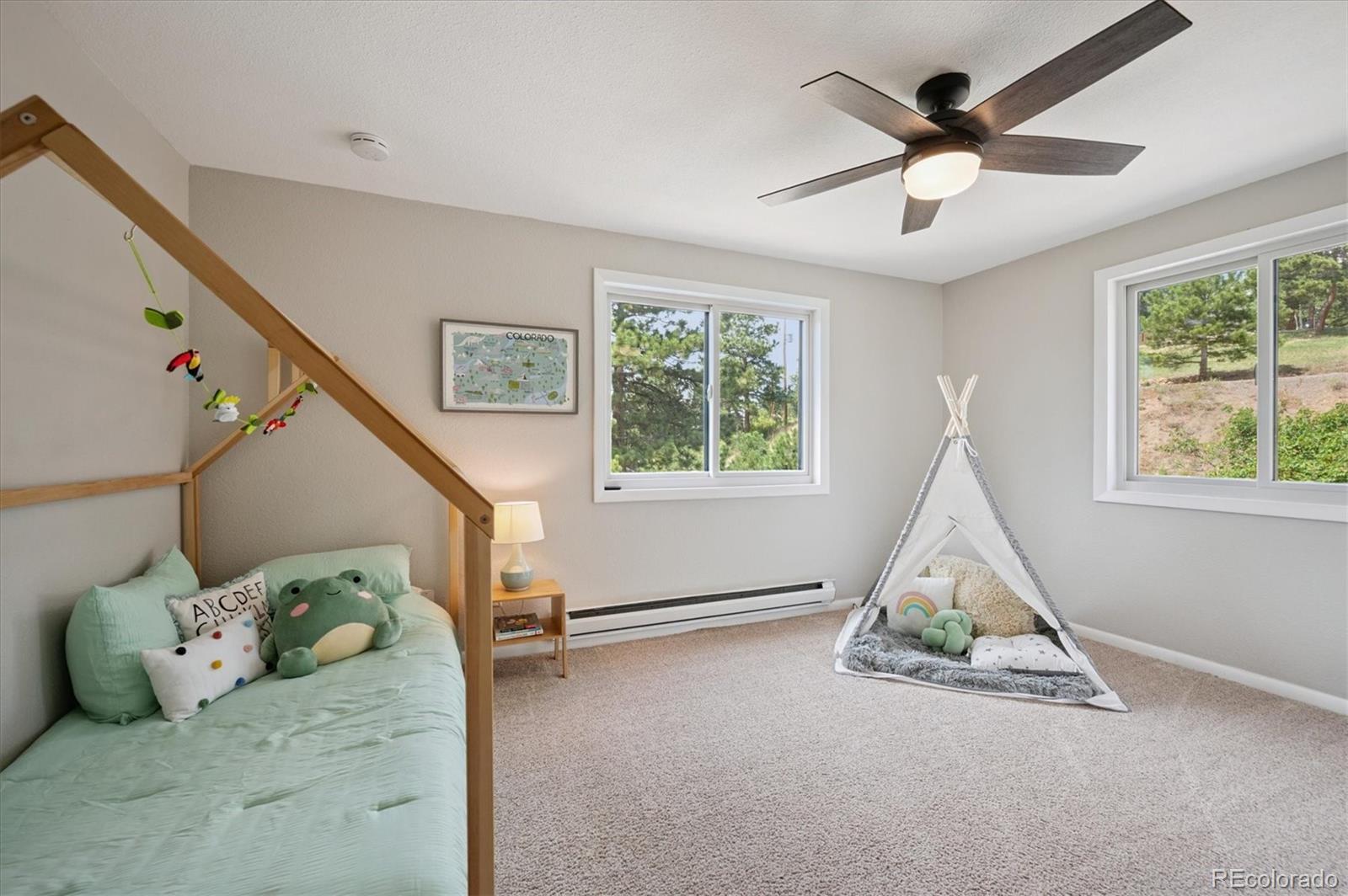 9189 Fallen Rock Road Conifer, CO 80433 - Photo 19 of 47 a view of livingroom with furniture and windows
