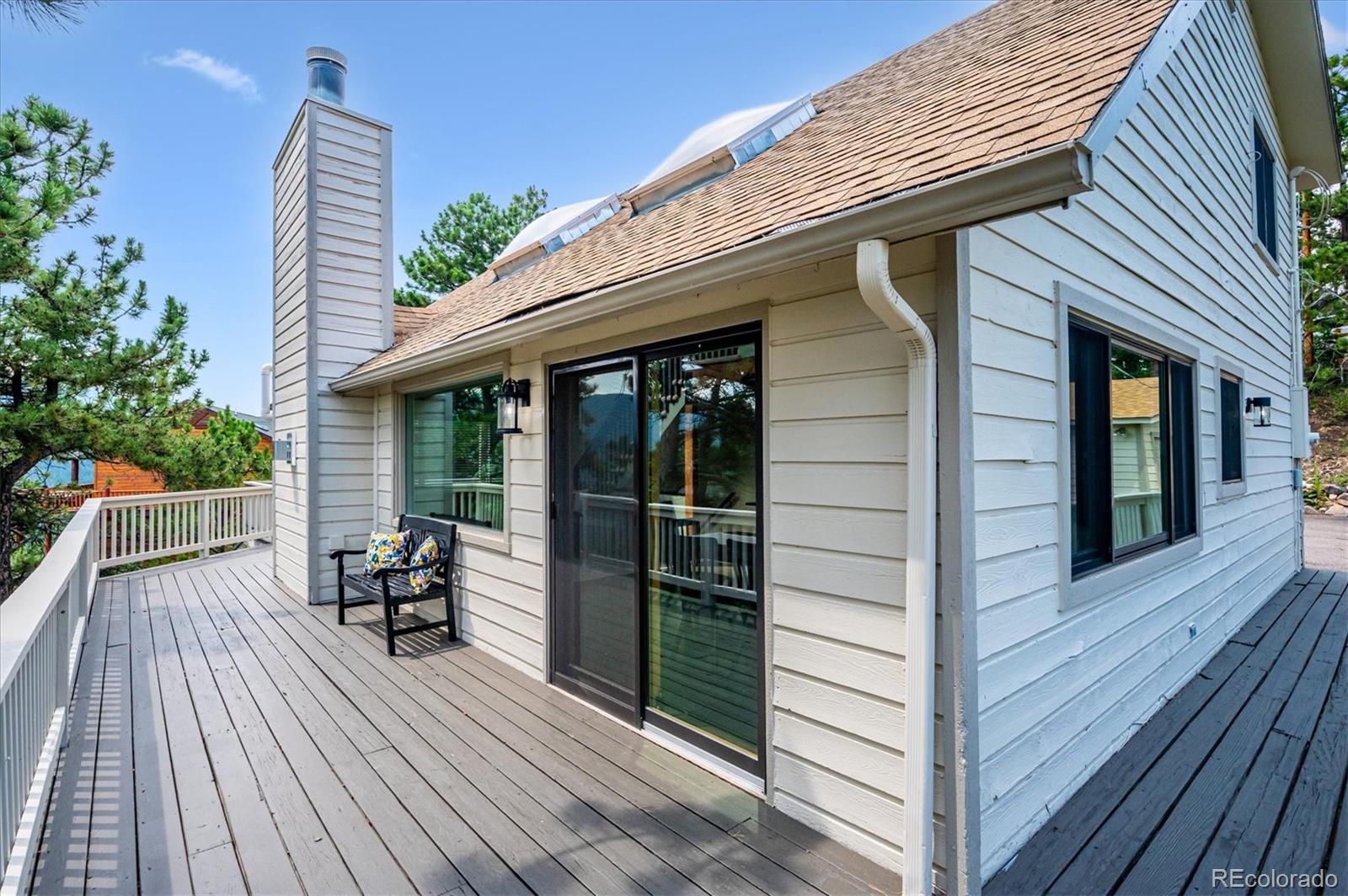 9189 Fallen Rock Road Conifer, CO 80433 - Photo 30 of 47 a porch with seating space