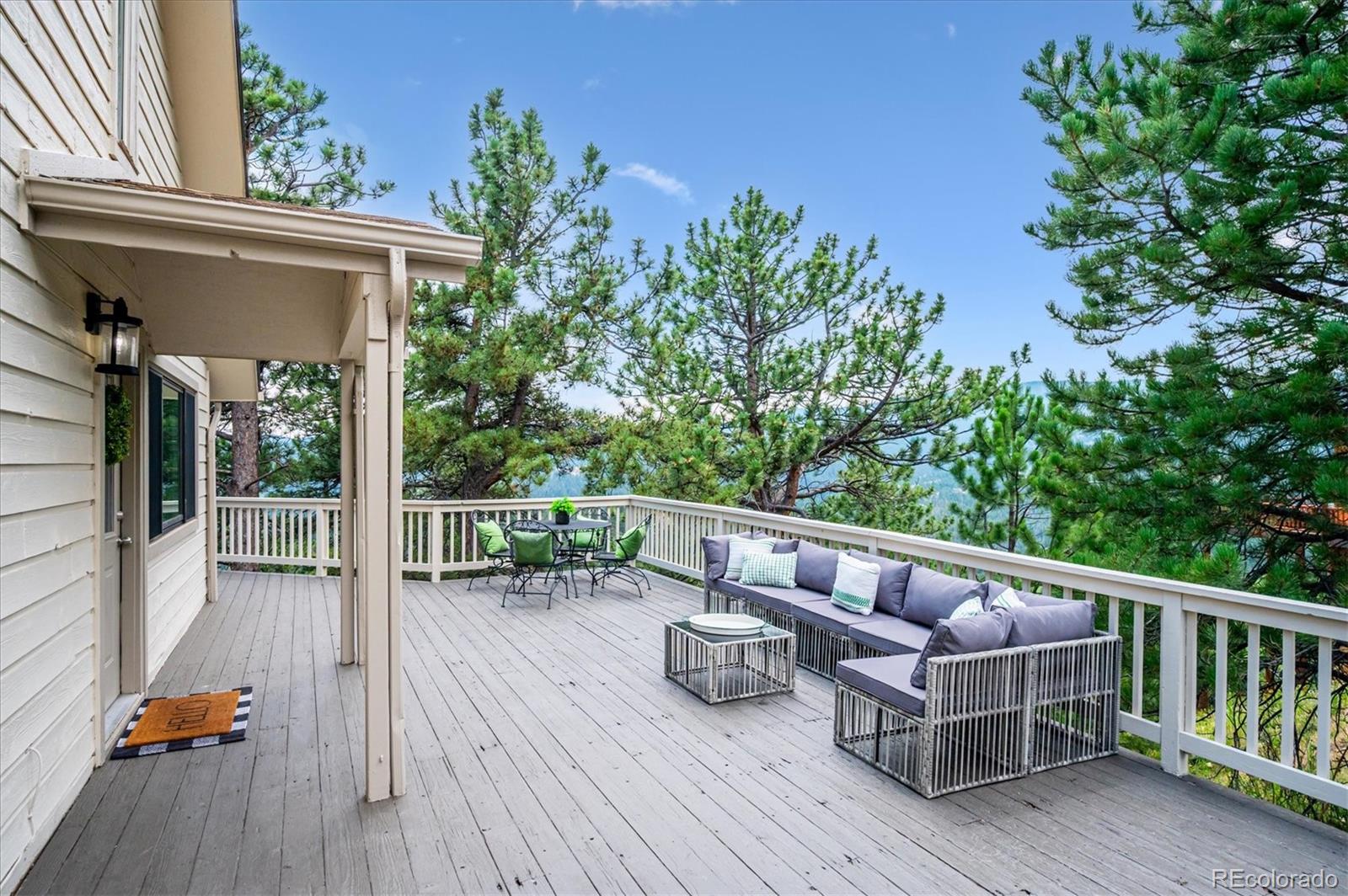 9189 Fallen Rock Road Conifer, CO 80433 - Photo 3 of 47 a view of porch with seating space