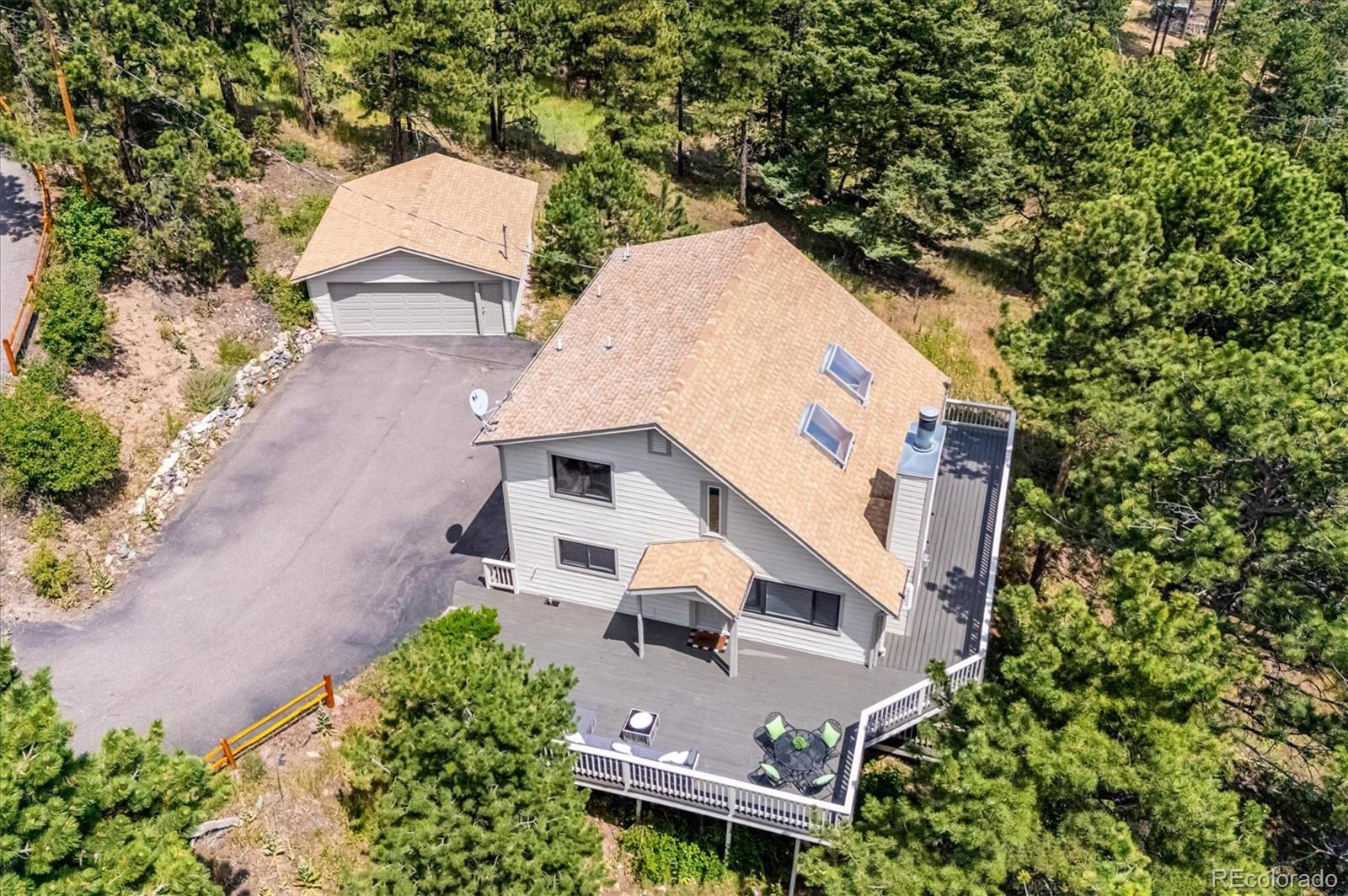 9189 Fallen Rock Road Conifer, CO 80433 - Photo 38 of 47 an aerial view of a house with outdoor space and sitting area