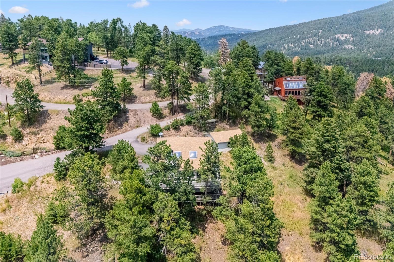9189 Fallen Rock Road Conifer, CO 80433 - Photo 39 of 47 an aerial view of residential house with outdoor space and trees all around