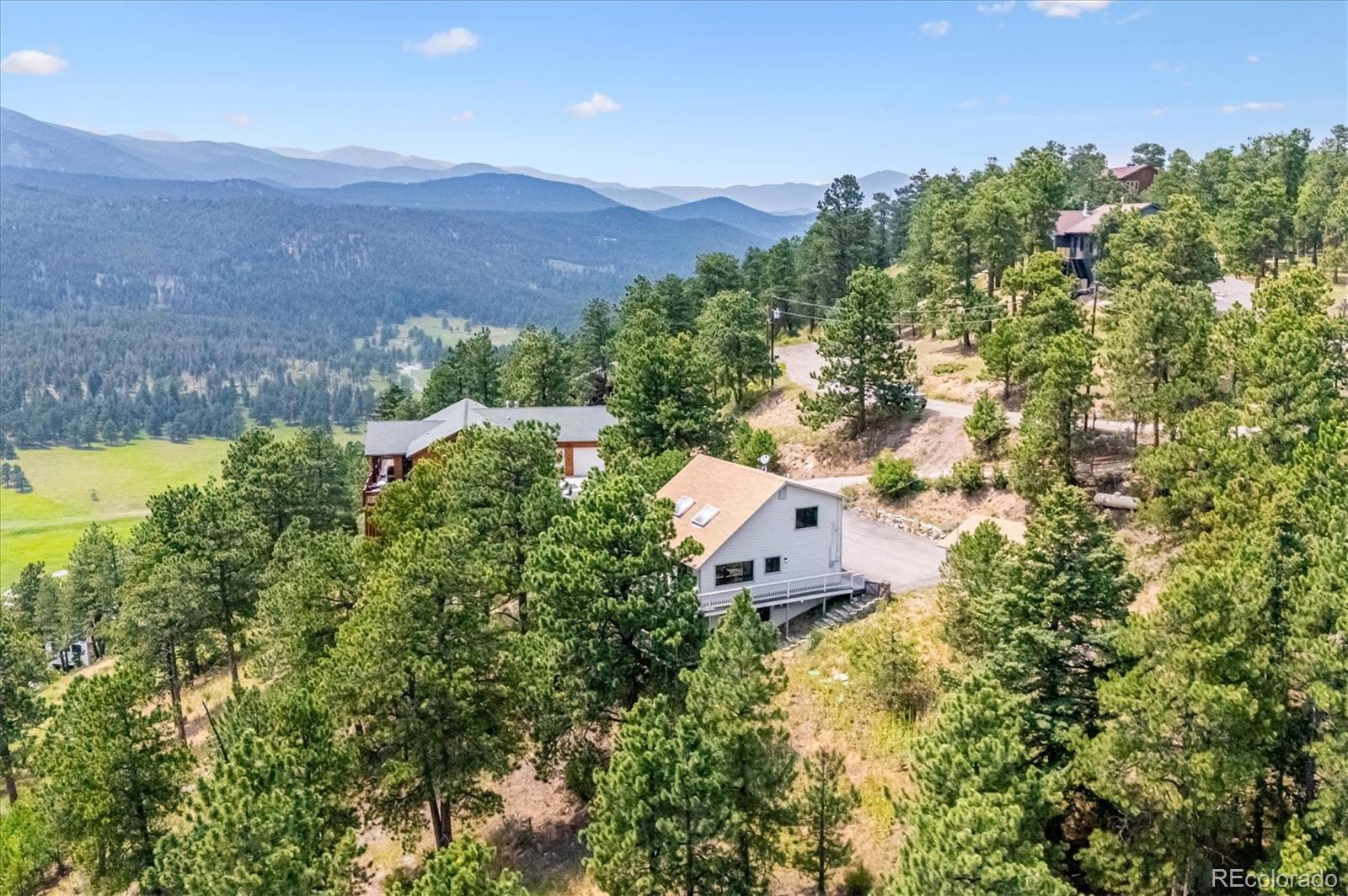 9189 Fallen Rock Road Conifer, CO 80433 - Photo 40 of 47 an aerial view of a house with a garden