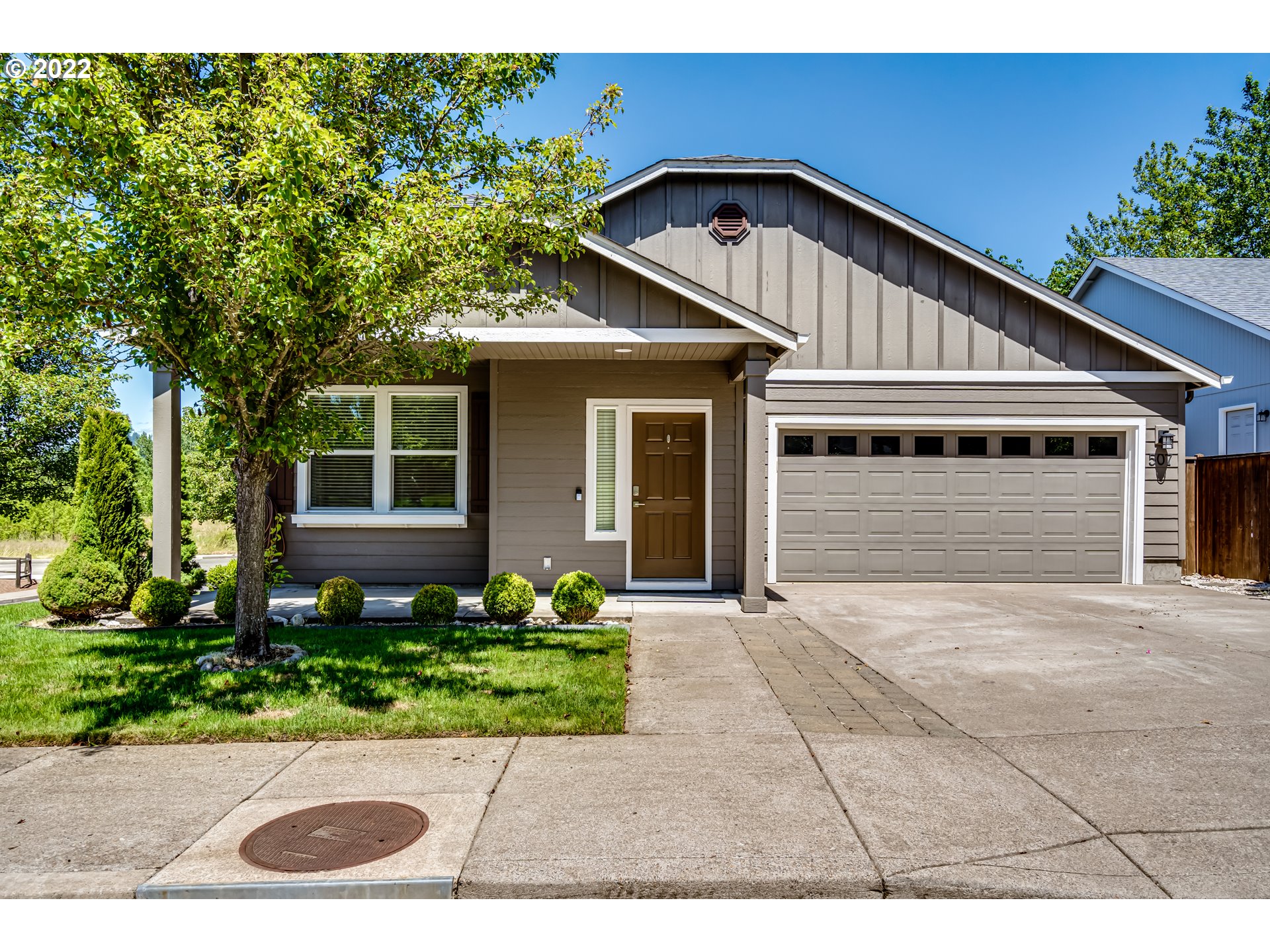 507 South 48th Place Springfield, OR 97478 - Photo 1 of 31 a front view of a house with a yard and potted plants