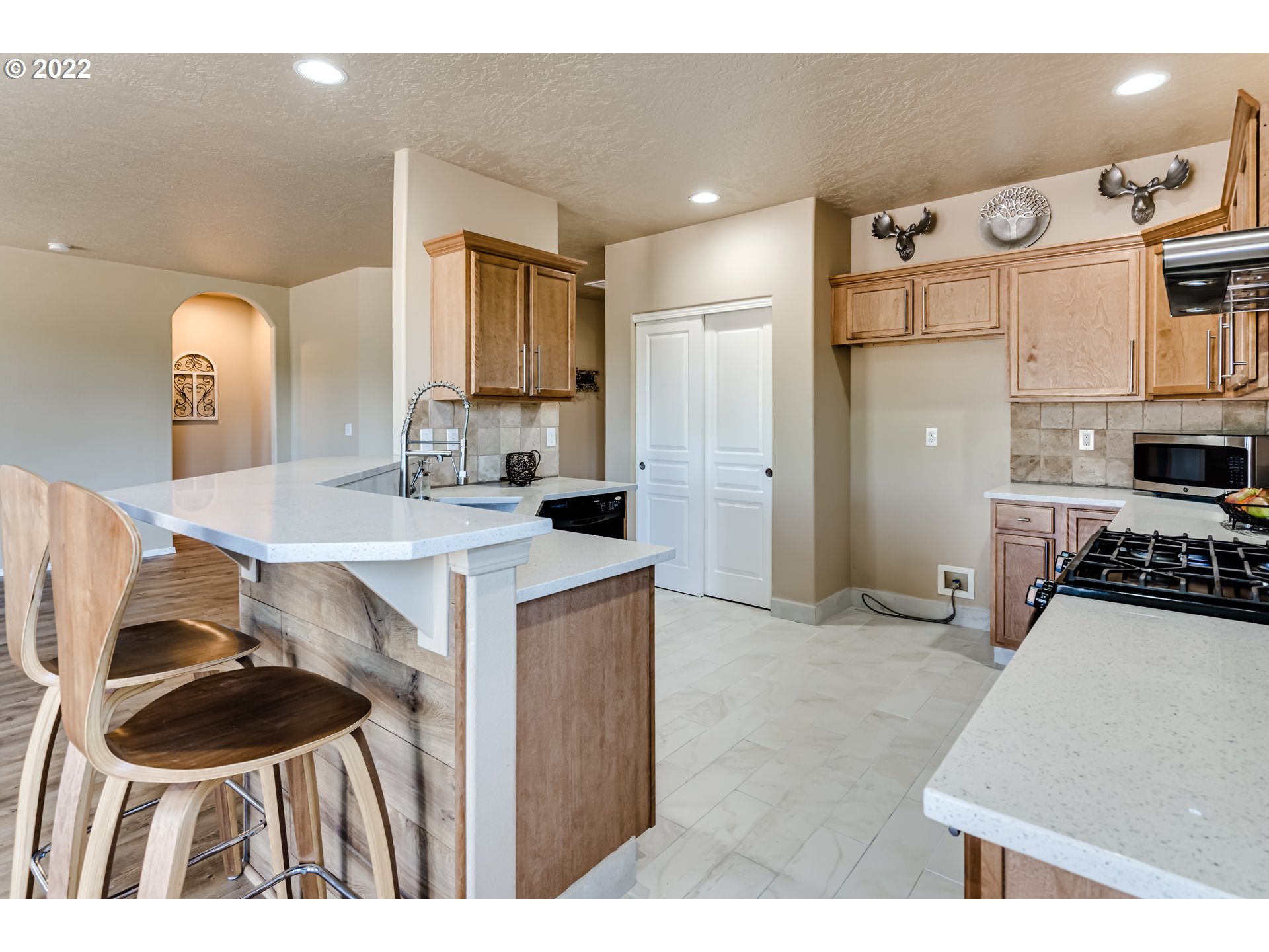 507 South 48th Place Springfield, OR 97478 - Photo 11 of 31 a kitchen with a sink and a stove top oven
