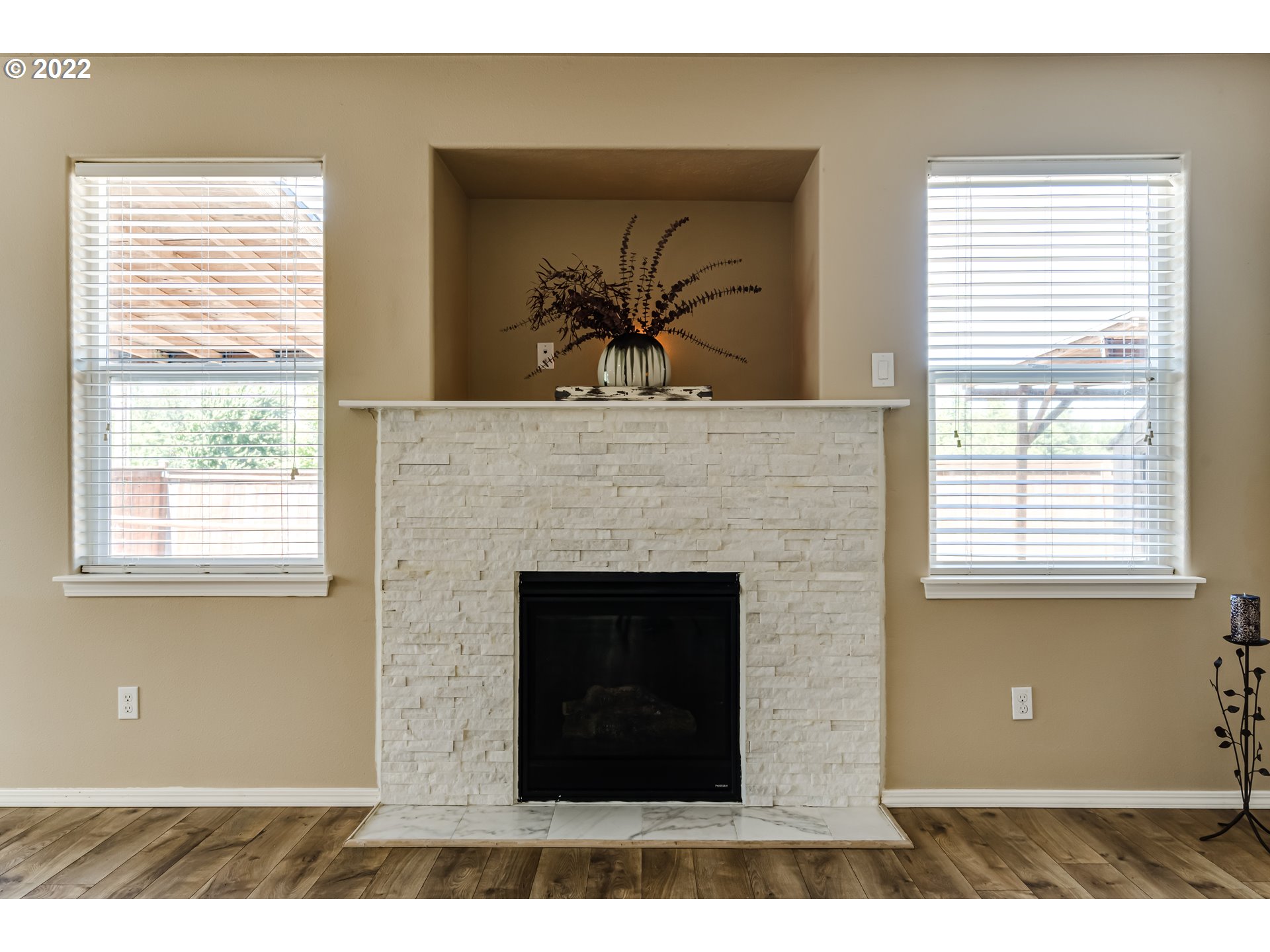 507 South 48th Place Springfield, OR 97478 - Photo 14 of 31 a living room with a fireplace and a large window