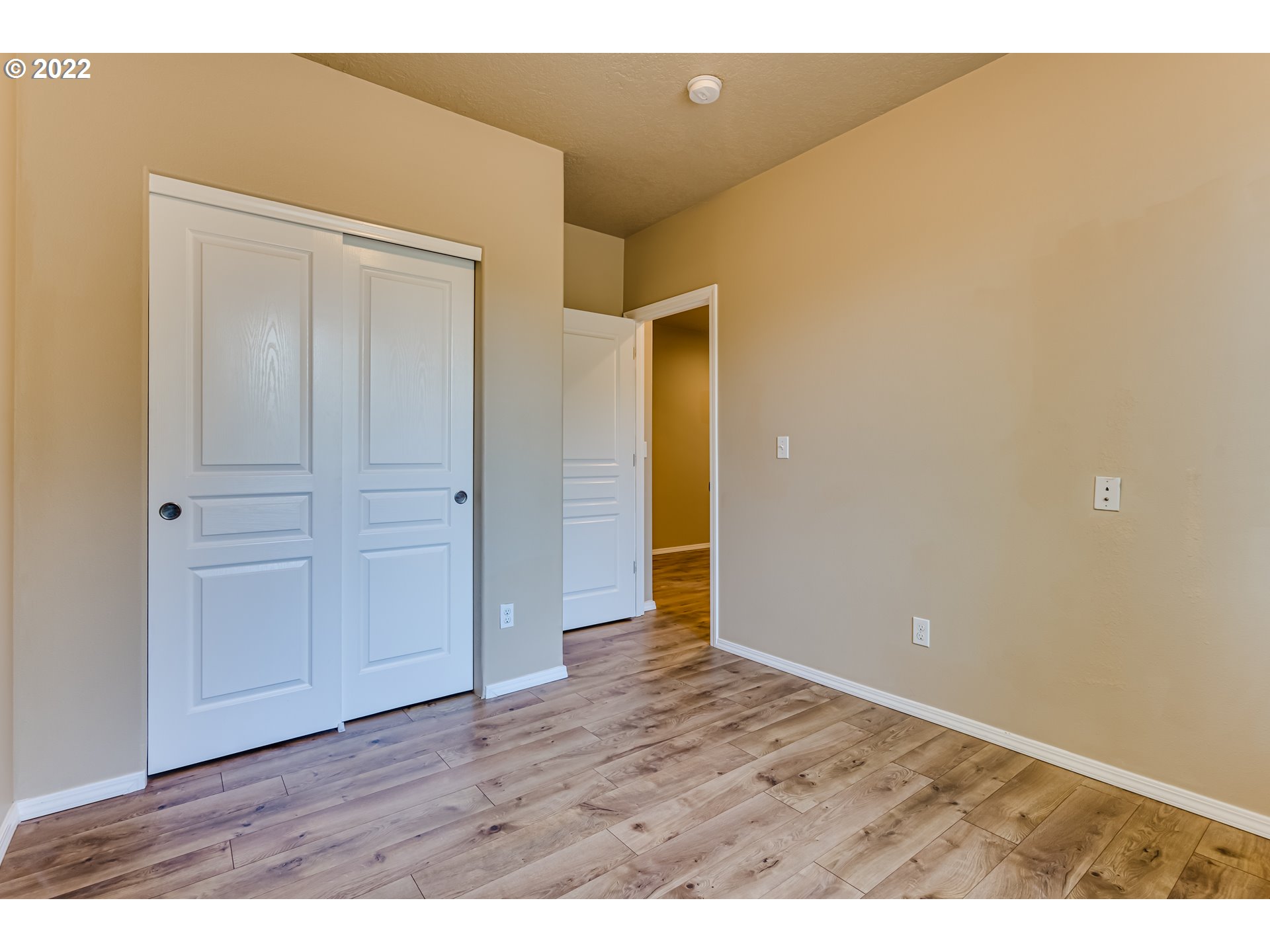 507 South 48th Place Springfield, OR 97478 - Photo 24 of 31 a view of an empty room with wooden floor