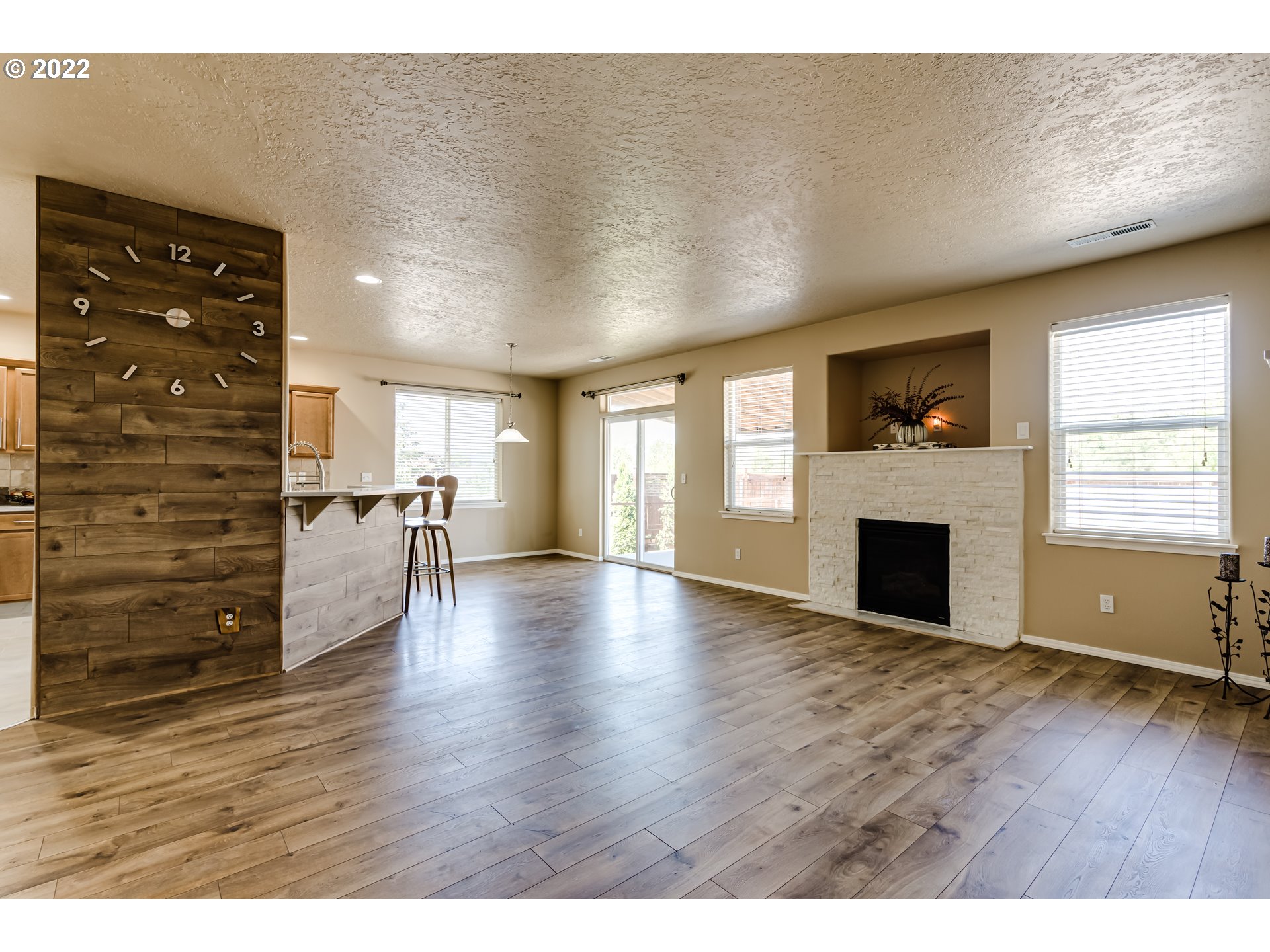 507 South 48th Place Springfield, OR 97478 - Photo 7 of 31 a view of an empty room with wooden floor and a window