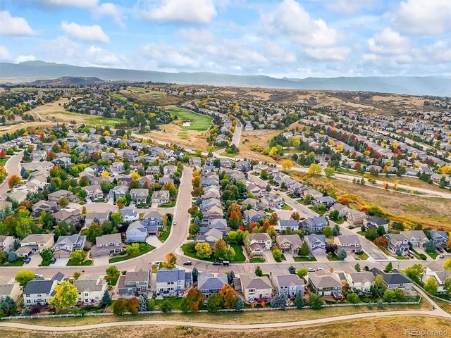 an aerial view of residential building with parking space