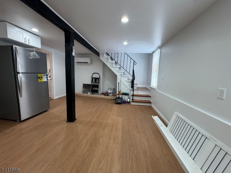 233 Franklin Road Denville, NJ 07834 - Photo 4 of 8 a view of an empty room with wooden floor
