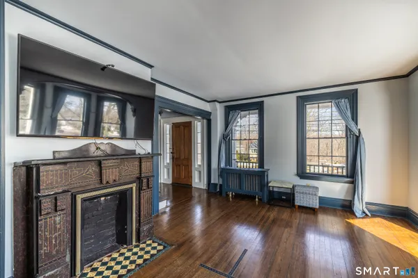 a living room with furniture and a fireplace